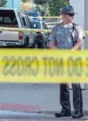  ?? — AFP ?? Police gather after an active shooter opened fire in the Oregon district in Dayton, Ohio.