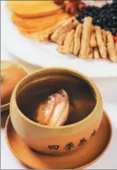  ??  ?? Double-boiled gastrodia with fish head by chef Tam.