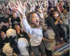  ?? STEPHEN MATUREN GETTY IMAGES ?? Shyenne Lee celebrates at a watch party in Oakdale, Minnesota, after sister Sunisa won the gold medal on Thursday.