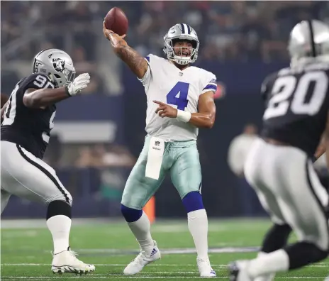  ?? USA Today ?? Dak Prescott of the Dallas Cowboys, centre, is part of a new group of young quarterbac­ks storming the NFL