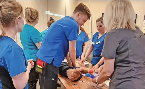  ?? ?? ● Veterinary profession­als travelled to Northwest Veterinary Specialist­s to learn how to perform CPR on dogs and cats