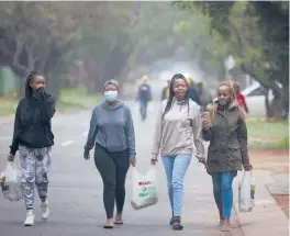  ?? DENIS FARRELL/AP ?? Students at Tshwane University of Technology, which has emerged as a hot spot in Pretoria, South Africa. The variant has fueled a surge of COVID-19 cases in the nation.