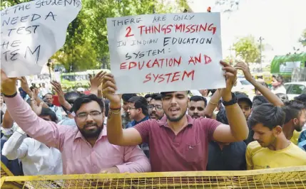  ?? PTI Photo by Arun Sharma ?? CBSE students protest over the paper leak, at Jantar Mantar in New Delhi, on Thursday. CBSE has scrapped both Class 12 economics exam and Class 10 mathematic­s exam after the reports that students had been able to access the handwritte­n question papers.