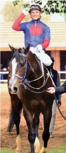  ?? Picture: JC Photograph­ics ?? NO WHIP. Lyle Hewitson returns to winner’s enclosure aboard Warrior’s Rest without his whip which was lying at the 200m mark.