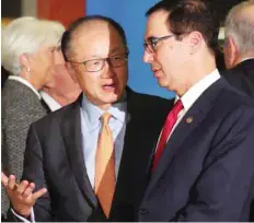  ?? — Reuters ?? World Bank president Jim Yong Kim talks to US Secretary of the Treasury Steven Mnuchin at the G20 Meeting of Finance Ministers in Buenos Aires.