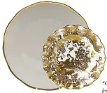  ?? ?? “Gwendolyn” dinner plate by Herend, $110; Copper Lamp “Gold Aves” accent salad plate by Royal Crown Derby, $235; Copper Lamp