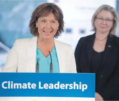  ?? JASON PAYNE ?? Premier Christy Clark, seen with B.C. Environmen­t Minister Mary Pollak, has frequently underscore­d the need for a mechanism to determine fairness and equity in the national carbon-pricing regime.