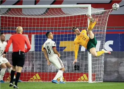  ?? Huw Evans Agency ?? Gareth Bale tries an ambitious overhead shot at goal in Leuven last night.