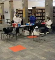  ?? COURTESY OF MARYBETH TORCHIA ?? Boyertown School District staff set up a vaccine clinic at Boyertown High School. More than 200distric­t staff members received the COVID-19 vaccine Wednesday through the Medicine Shoppe Pharmacy.