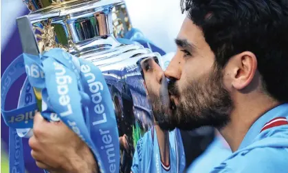  ?? Wilson/Offside/Getty Images ?? Ilkay Gündogan lifted the Premier League trophy for Manchester City on Sunday but it is out of contract in the summer. Photograph: Charlotte