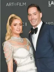  ?? RICHARD SHOTWELL/INVISION 2021 ?? Paris Hilton, left, and husband Carter Reum have welcomed their first child, a boy.