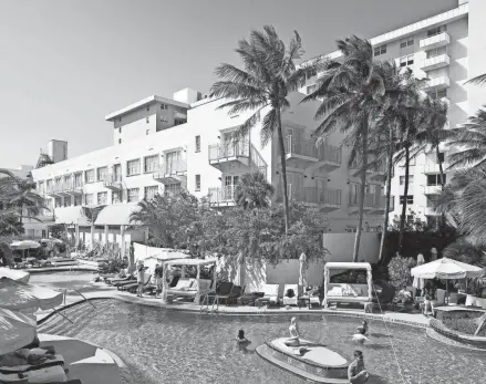  ?? MORIS MORENO/NEW YORK TIMES ?? The swimming pool at the Savoy Hotel in Miami Beach on March 18. Establishm­ents like the Savoy Hotel helped keep Miami Beach afloat during the Great Depression.