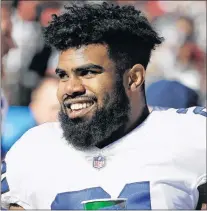  ?? AP PHOTO ?? Dallas Cowboys running back Ezekiel Elliott smiles on the sideline after scoring a touchdown during an NFL game against the San Francisco 49ers in Santa Clara, Calif. on Sunday.