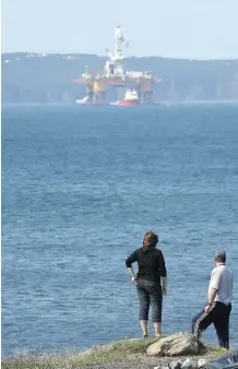  ?? FOR CALGARY HERALD
TIM FRASER/ ?? An offshore oil rig sits in a bay outside of St. John’s, N. L.,. A new simplified royalty system is to be put in place and will apply to all new production licences, including Bay du Nord oilfield, the largest global discovery in 2013, said to contain...