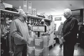  ?? Donnis Hueftle-Bullock ?? Brian and Heidi Beaumont, owners of Ansley Lumber, show Lt. Gov. Foley the main lumber store building that has been serving the area for 130 years.