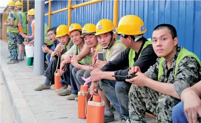  ??  ?? File picture of Chinese workers at a constructi­on site in Sri Lanka.