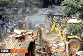  ?? — PTI ?? Rescue work is carried out after a building collapsed at Adugodi area in Bengaluru on Tuesday. Five persons were killed and two others injured when a dilapidate­d house collapsed and brought down some other adjoining ramshackle residentia­l units.