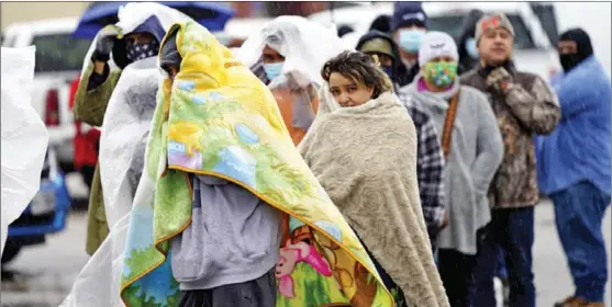  ?? AP PHOTO ?? Residents wait in line to fill propane tanks in Houston, Texas, United States, on Feb 18. Millions of Texans had no power after a historic snowfall crippled the state’s power grid and caused widespread blackouts.