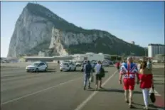  ?? MARCOS MORENO - THE ASSOCIATED PRESS ?? In this 2017 file photo, people coming from Spain cross the airport of Gibraltar to take part at the National Day celebratio­ns at the British territory of Gibraltar.