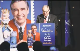  ??  ?? WQED Art Director Jim Cunningham attends the U.S. Postal Service Dedication of the Mister Rogers Forever Stamp at WQED’s Fred Rogers Studio Friday in Pittsburgh, Pa.