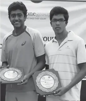  ??  ?? Mumbai’s Aryan Goveas and Aditya Gokhale of Pune pose with their trophies after a 7- 5, 1- 6, 10- 8 victory over Pune’s Sahil Deshmukh and Delhi’s Basil Khuma in the boys’ doubes final of the ITF Under- 18 grade 4 tournament in Chennai.