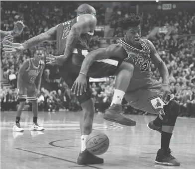  ?? FRANK GUNN / THE CANADIAN PRESS ?? Raptors forward P.J. Tucker’s defensive play helped make life tougher for Bulls star Jimmy Butler during Toronto’s comeback win over Chicago on Tuesday night. Tucker held Butler to just 13 points over the final 21 minutes.