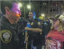  ?? Ringo H.W. Chiu Associated Press ?? A DEMONSTRAT­OR confronts a Department of Homeland Security officer at an abortion rights protest near Pershing Square in downtown L.A.