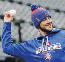  ?? DAVID J. PHILLIP/ASSOCIATED PRESS ?? Like his Chicago Cubs teammates, third baseman Kris Bryant says he’s focused on beating the Cleveland Indians, not ending the team’s legendary World Series drought, when the two teams meet for Game 1 of the World Series tonight.