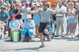  ?? RICK MADONIK PHOTOS/TORONTO STAR ?? Theo Filipoulos dances during the Taste of the Danforth street festival on Saturday afternoon.