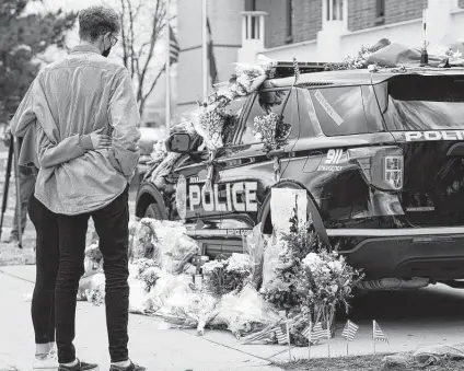  ?? David Zalubowski / Associated Press ?? A couple hug Tuesday after leaving a bouquet on a police cruiser outside the Boulder Police Department, which lost an officer in the rampage at a King Soopers grocery store the day before.
Boulder police officer Eric Talley, 51, was described as a devoted father of seven.
Ahmad Al Aliwi Alissa, who was born in Syria, was described by his brother as mentally ill.