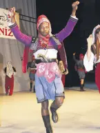  ??  ?? Mugenzi poses like an “efe” during zeibek dance.