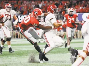  ?? Kevin C. Cox / Getty Images ?? Alabama’s Jalen Hurts rushes for a 15-yard touchdown in the fourth quarter against Georgia in the SEC championsh­ip game Saturday.