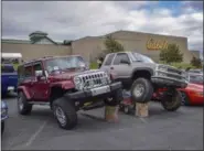  ??  ?? This 2013 Jeep Wrangler Unlimited Rubicon and the Chevy truck parked next to it drew the attention of everyone that walked past their unique display of the vehicles during the Berks County Mustang Car Club Trunk or Treat Car Show at Cabela’s in Tilden Township.