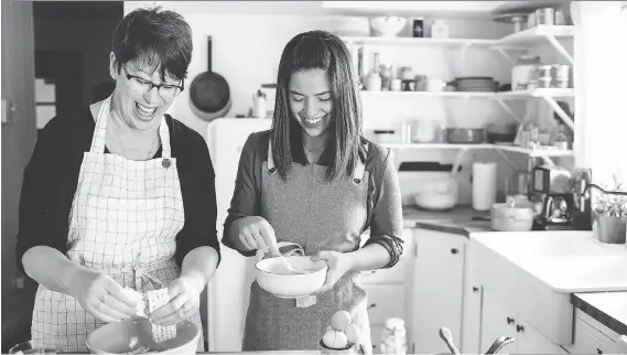  ?? CHANTELL QUERNEMOEN ?? Molly Yeh and her mother prepare the popular Passover dish matzo brei, which is akin to French toast. To make matzo brei, shards of matzo are softened, stirred with beaten eggs and cooked in a skillet until set.
