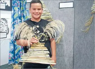  ??  ?? PERSEVERAN­CE: Wairangi Te Hiko made his first Maori kite, a manu tukutuku, and was challenged to make it without modern utensils such as scissors.