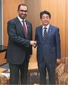  ?? WAM ?? Dr Sultan Ahmad Al Jaber with Shinzo Abe, Prime Minister of Japan during a visit to Tokyo.