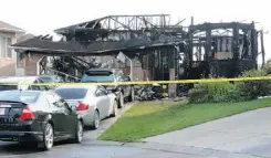  ?? CANDACE ELLIOTT/ EDMONTON JOURNAL ?? One Mill Woods home was destroyed and a second badly damaged after fire broke out early Monday.