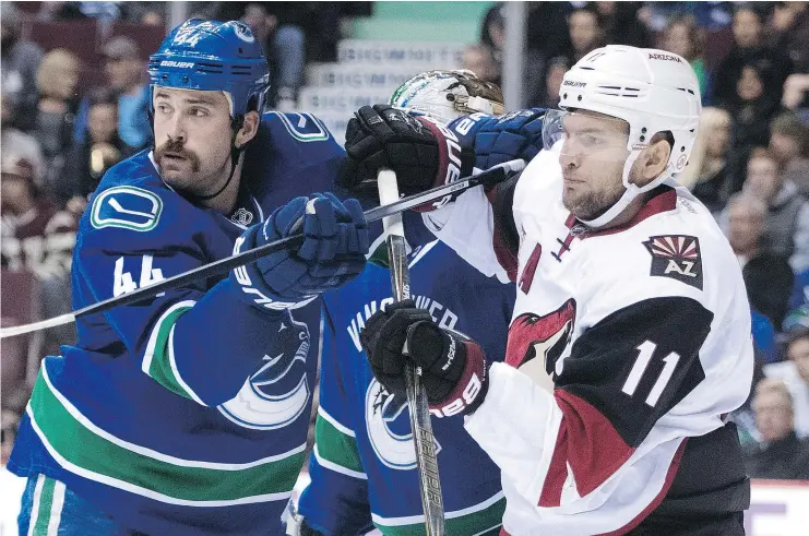  ?? — CP FILES ?? Erik Gudbranson, left, has proved adept at standing up opposing forwards at the blue-line and forcing them to dump the puck into the Canucks’ zone.