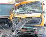  ?? MANOJ DHAKA/HT ?? The mangled remains of the school bus and the truck (right) that collided headon in Charkhi Dadri district on Monday.