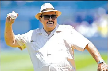  ?? KELVIN KUO/AP PHOTO ?? Los Angeles Dodgers scout Mike Brito throws out the first pitch prior to a baseball game between the Dodgers and the Colorado Rockies, in 2016.