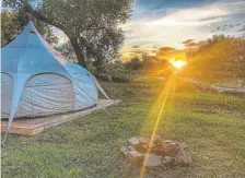  ?? Joshua Berman, Special to The Denver Post ?? The Lotus Belle platform tents at the Platte River Fort Resort & Event Center camping area are roomy and equipped with simple beds and furnishing­s, making camping easy and enjoyable along the South Platte River in northeast Colorado.