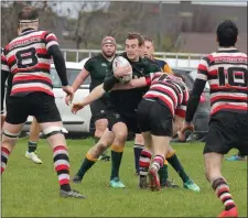  ??  ?? Boyne’s Eoghan Duffy has nowhere to go as he is stopped in his tracks by Enniscorth­y’s Killian Lett.