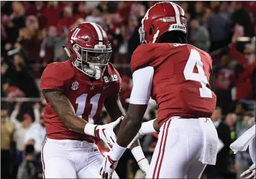  ?? HARRY HOW — GETTY IMAGES ?? Alabama’s Jerry Jeudy, right, is congratula­ted by Henry Ruggs III after scoring against Clemson in the CFP National Championsh­ip. They are two of many good possible options for the Raiders in this year’s draft.