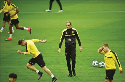  ?? — AFP ?? LISBON: Dortmund’s head coach Thomas Tuchel attends a training session at Alvalade stadium in Lisbon yesterday, on the eve of the UEFA Champions League group F football match Sporting CP vs Borussia Dortmund.