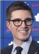  ?? CANADIAN PRESS FILE PHOTO ?? Maple Leafs GM Kyle Dubas, left, said the team will start the season without a captain, a role new Toronto star John Tavares filled with the New York Islanders.