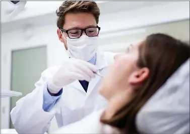  ?? ?? FILL THE GAPS: Patients are facing long waits for appointmen­ts with NHS dentists