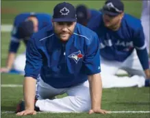  ?? CANADIAN PRESS FILE PHOTOS ?? Toronto Blue Jays catcher Russell Martin, right, decided to take up swimming as an off-season workout option a year ago, and was amazed at how quickly he progressed in the pool. It didn’t hurt that his coach and training partner was Paralympic star...