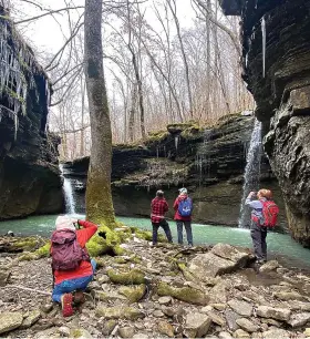  ?? (Special to the Democrat-Gazette/Bob Robinson) ?? Theresa-Beshara Cox (from left), Denise Longley, Dalene Ketcher and Nancy Stewart take in the view of LIttle Cow Creek during an outing in the Ozarks north of Hagerville, with the Takahik River Valley Hikers on Feb. 4, 2023.