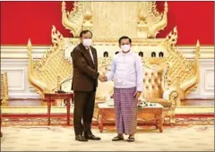  ?? MFAIC ?? Foreign minister Prak Sokhonn (left) shakes hands with SAC chairman Senior General Min Aung Hlaing in Myanmar on Monday.