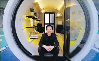 ?? VINCENT YU, THE ASSOCIATED PRESS ?? Architect James Law has come up with an idea to alleviate the high cost of housing in Hong Kong: Build stylish micro-apartments inside giant concrete drainage pipes.